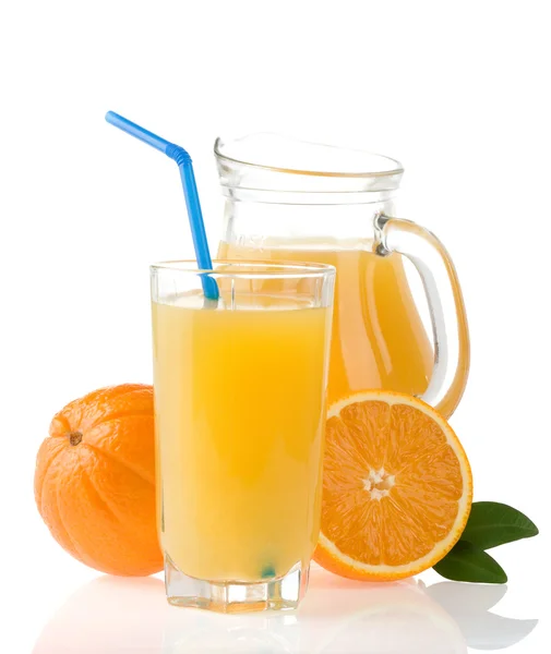 orange juice in glass and slices on white