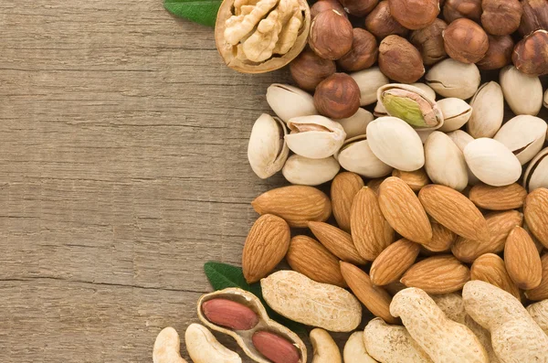 Set of nuts fruit on wood background — Stock Photo, Image