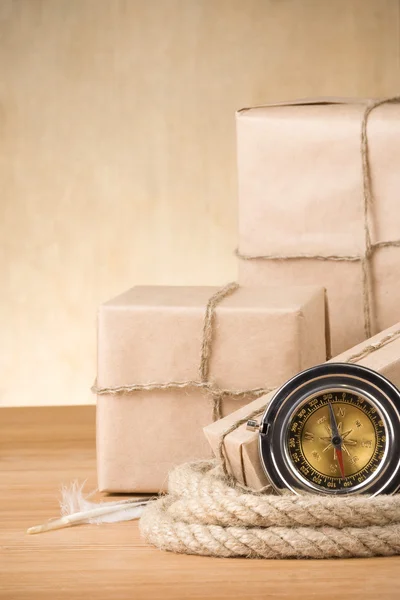 Parcel wrapped with brown paper tied with rope — Stock Photo, Image