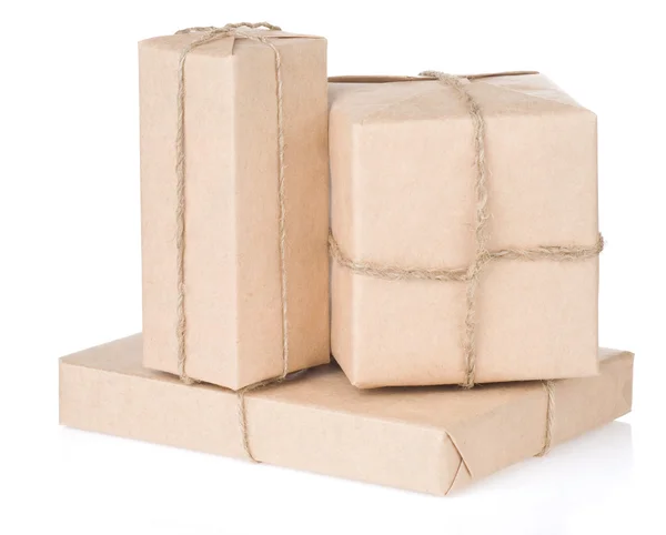 Parcel wrapped tied with rope on white — Stock Photo, Image