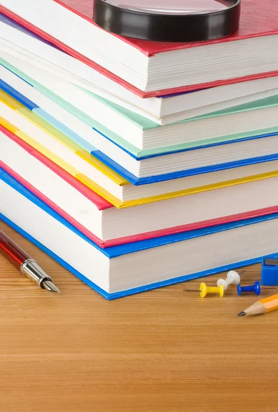 Pile of books on wood — Stock Photo, Image