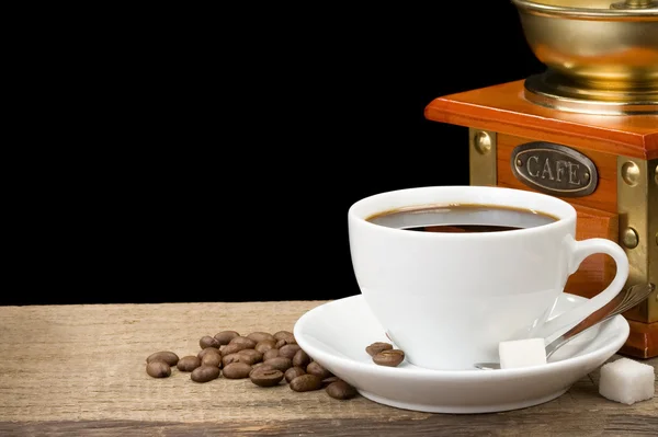 Cup of coffee and beans isolated on black — Stock Photo, Image