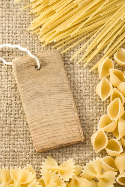 Pasta and price tag on sack burlap — Stock Photo, Image