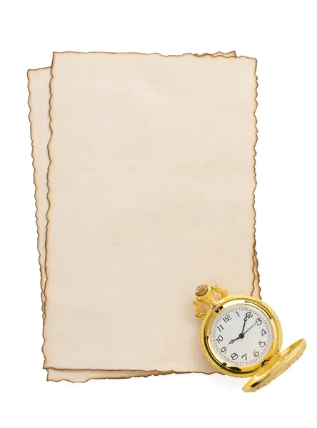 Часы на пергаменте на белом — стоковое фото