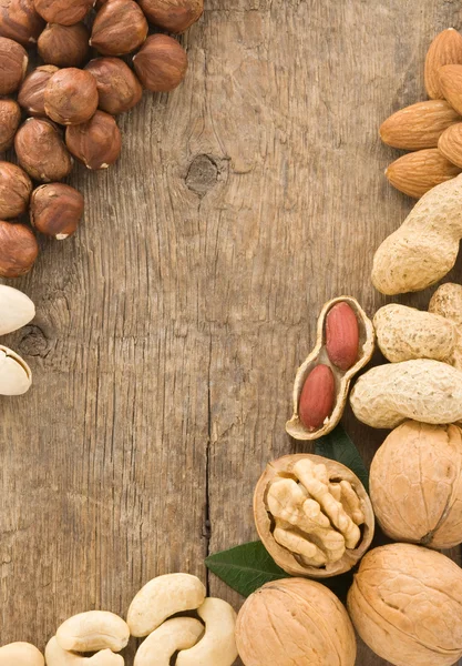 Variety of nuts on wood — Stock Photo, Image