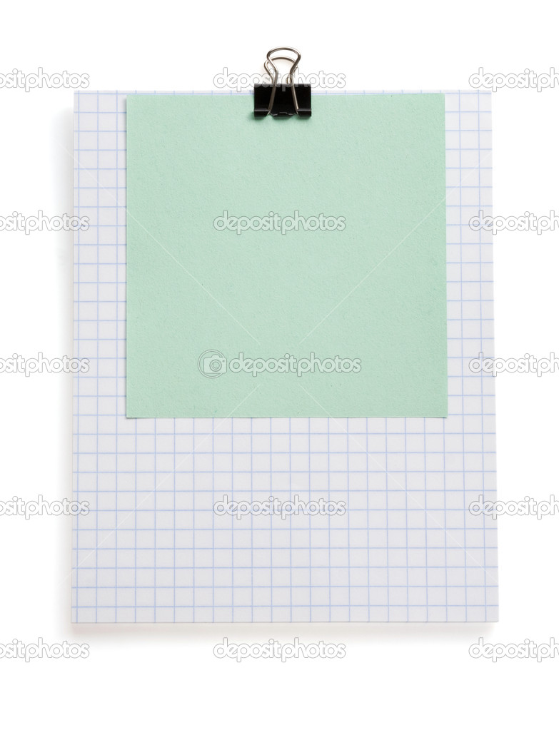 note checked paper and clip on white