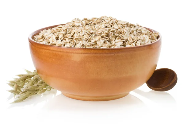 Bowl of oat flake on white — Stock Photo, Image