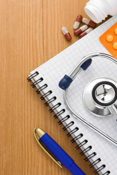 Medical stethoscope with pills — Stock Photo, Image