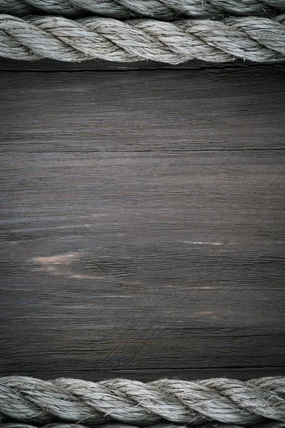 Cuerdas de barco en textura de fondo de madera — Foto de Stock