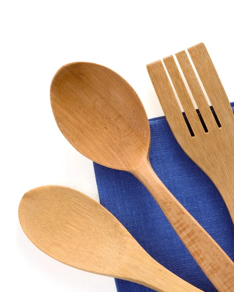 Wood utensils at table napkins — Stock Photo, Image