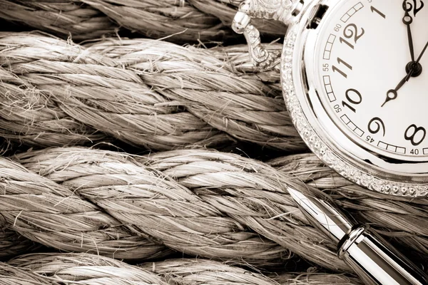 Watch with pen on ship ropes — Stock Photo, Image