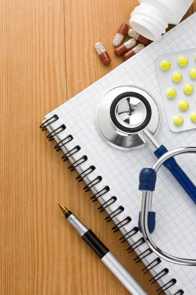 Medical stethoscope with pills — Stock Photo, Image