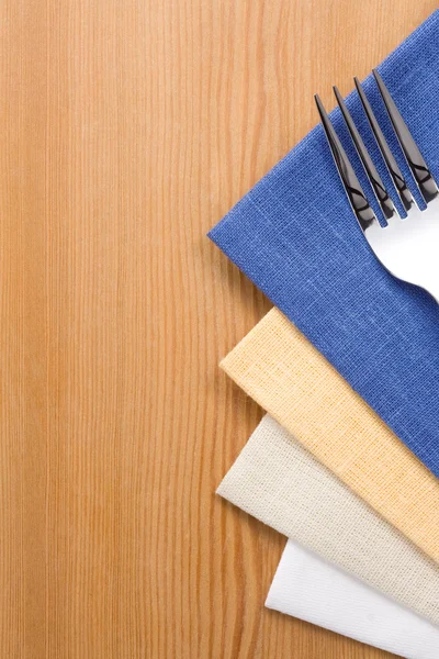 Fork and knife as utensils on napkin on wood — Stock Photo, Image