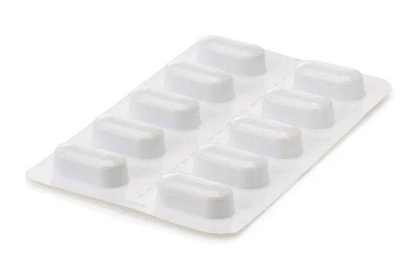 Krabičku pilulek na bílém pozadí — Stock fotografie