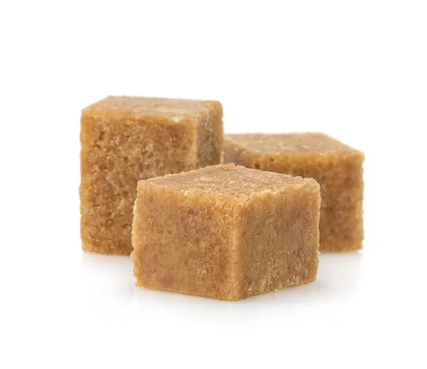 Brown sugar cubes on white — Stock Photo, Image