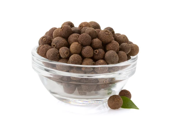 Allspice in bowl on white — Stock Photo, Image