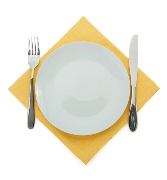 Plate, knife and fork on white — Stock Photo, Image