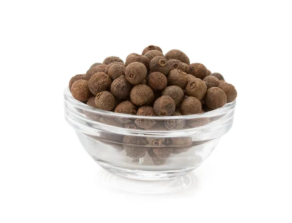 Allspice in bowl on white — Stock Photo, Image