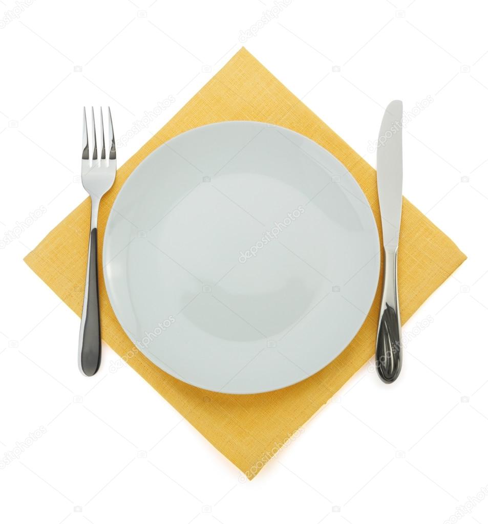 plate, knife and fork on white