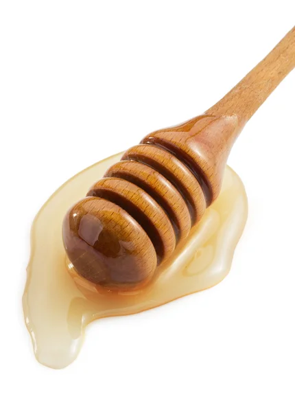 Honey and stick on white — Stock Photo, Image