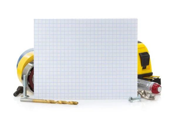 Notebook en tools op wit — Stockfoto