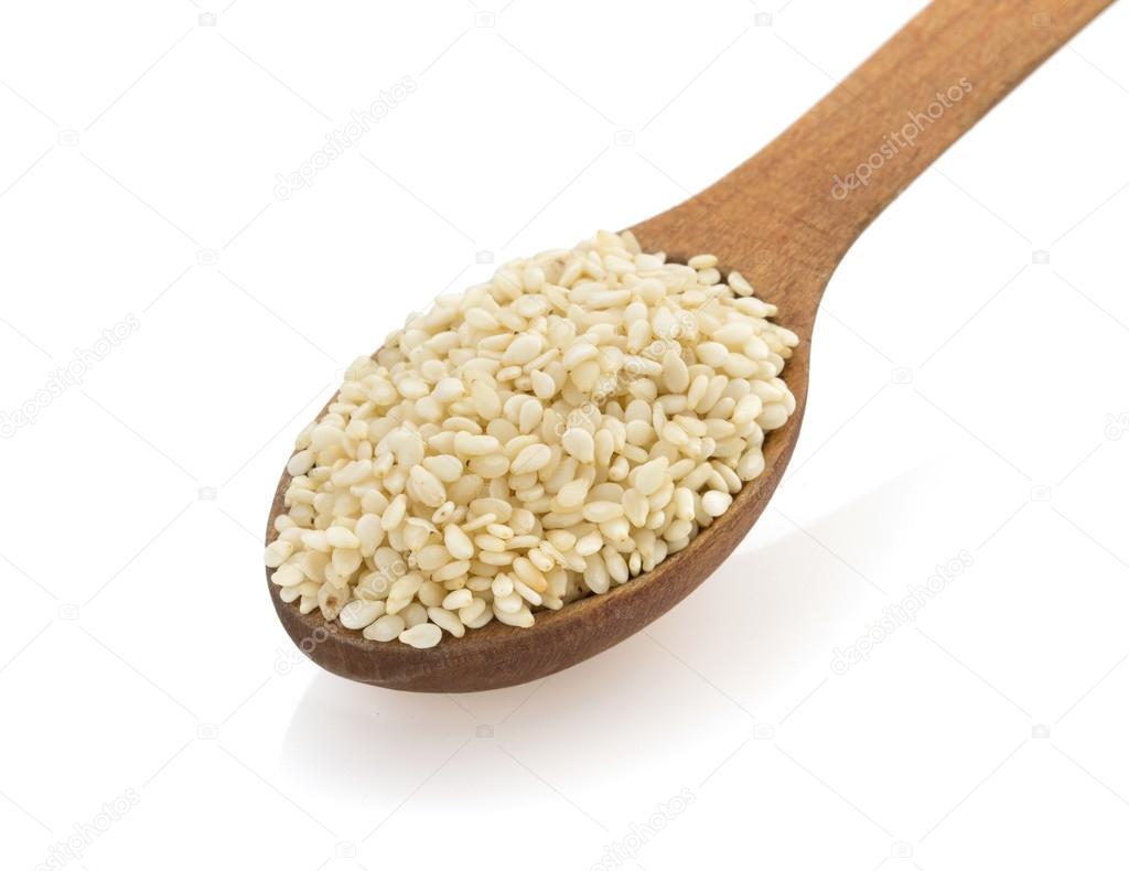sesame seed in spon on white