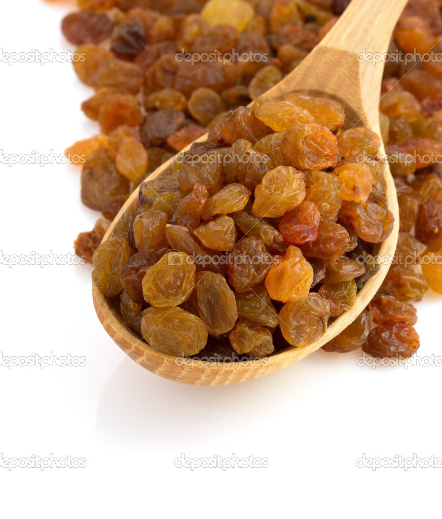 raisins in spoon on white