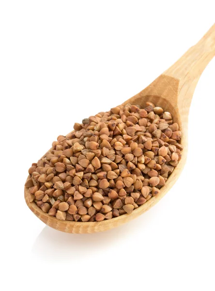 Buckwheat in spoon on white — Stock Photo, Image