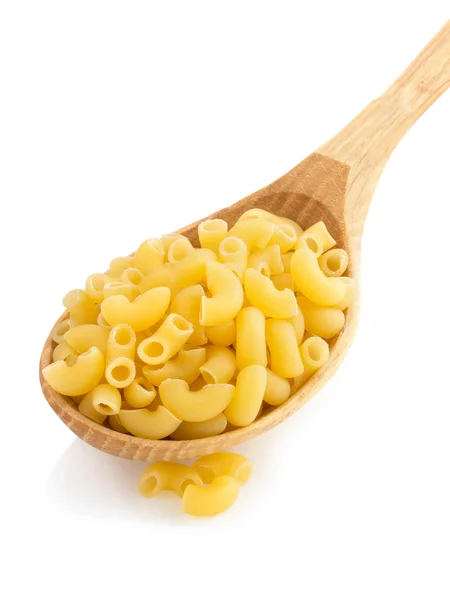 Raw pasta in spoon on white — Stock Photo, Image