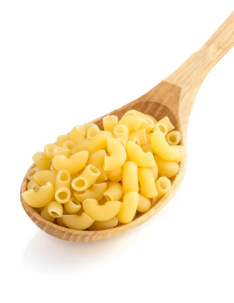 Raw pasta in spoon on white — Stock Photo, Image