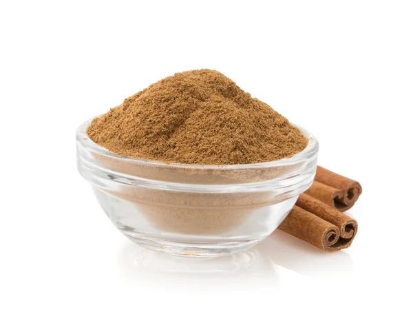 Cinnamon in bowl on white — Stock Photo, Image