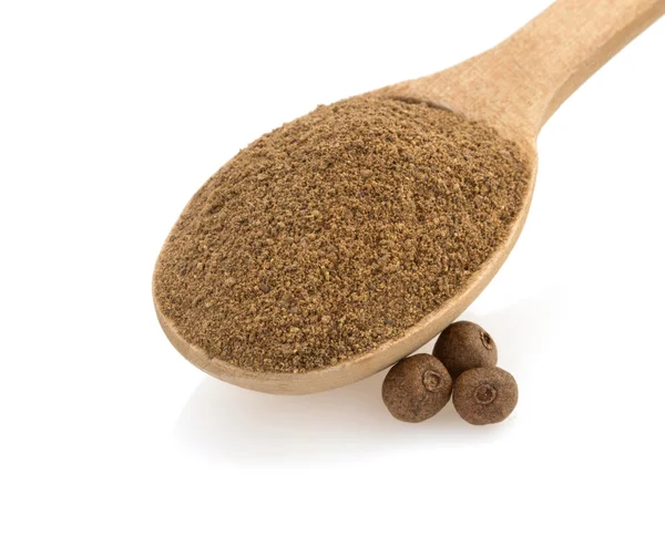 Allspice in spoon on white — Stock Photo, Image