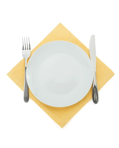 Plate, knife and fork on white — Stock Photo, Image