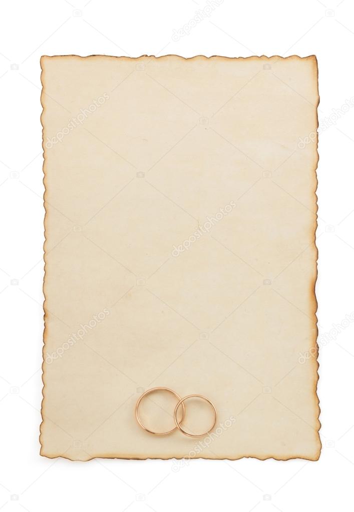 wedding ring and aged paper