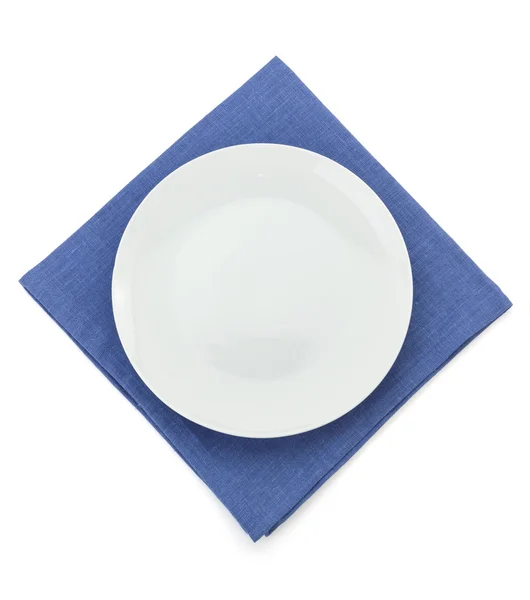 Plate at napkin on white — Stock Photo, Image