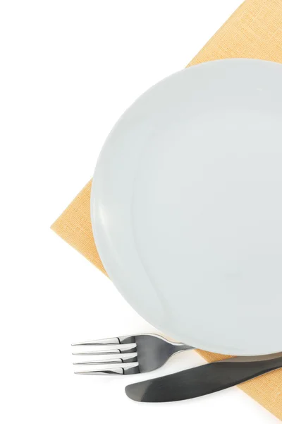 Piatto, coltello e forchetta su bianco — Foto Stock