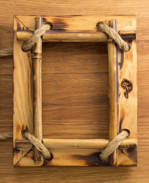 Photo frame on wood — Stock Photo, Image