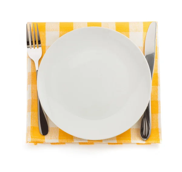 Plate, knife and fork at napkin — Stock Photo, Image