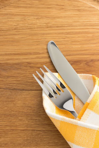 Knife and fork at napkin — Stock Photo, Image