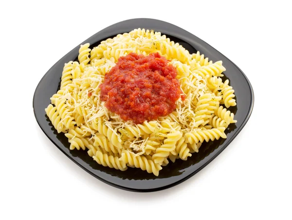 Pasta fusilli in plate — Stock Photo, Image