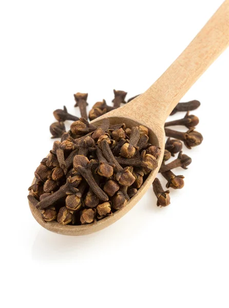 Clove spices and spoon Royalty Free Stock Images