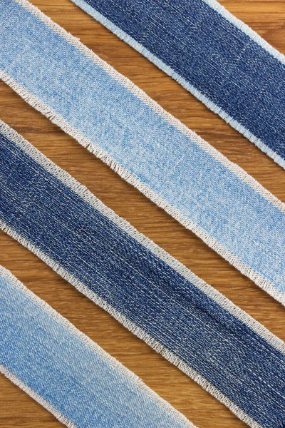 Jeans strips at wood — Stock Photo, Image