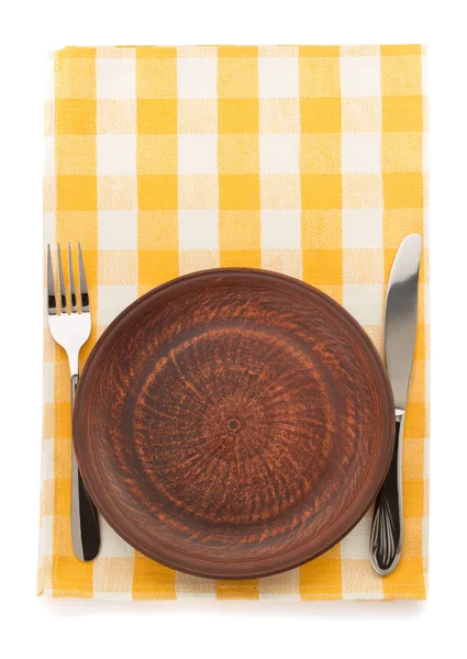 Plate, knife and fork  at cutting board — Stock Photo, Image