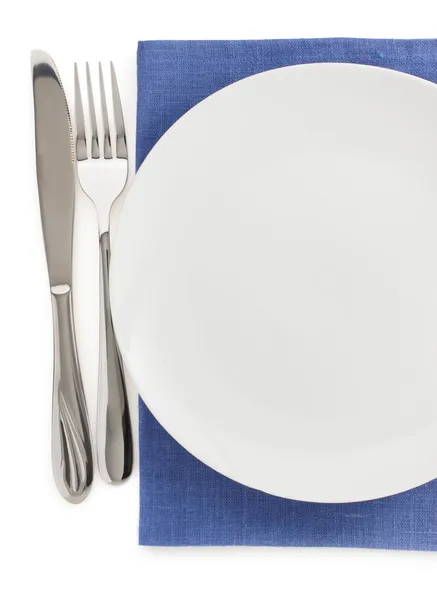 Plate, knife and fork at napkin — Stock Photo, Image