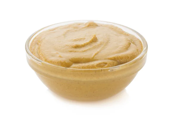 Mustard sauce in bowl on white — Stock Photo, Image