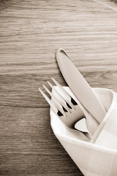 Knife and fork at napkin — Stock Photo, Image