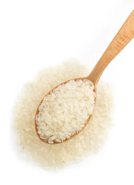 Reis im Kochlöffel — Stockfoto