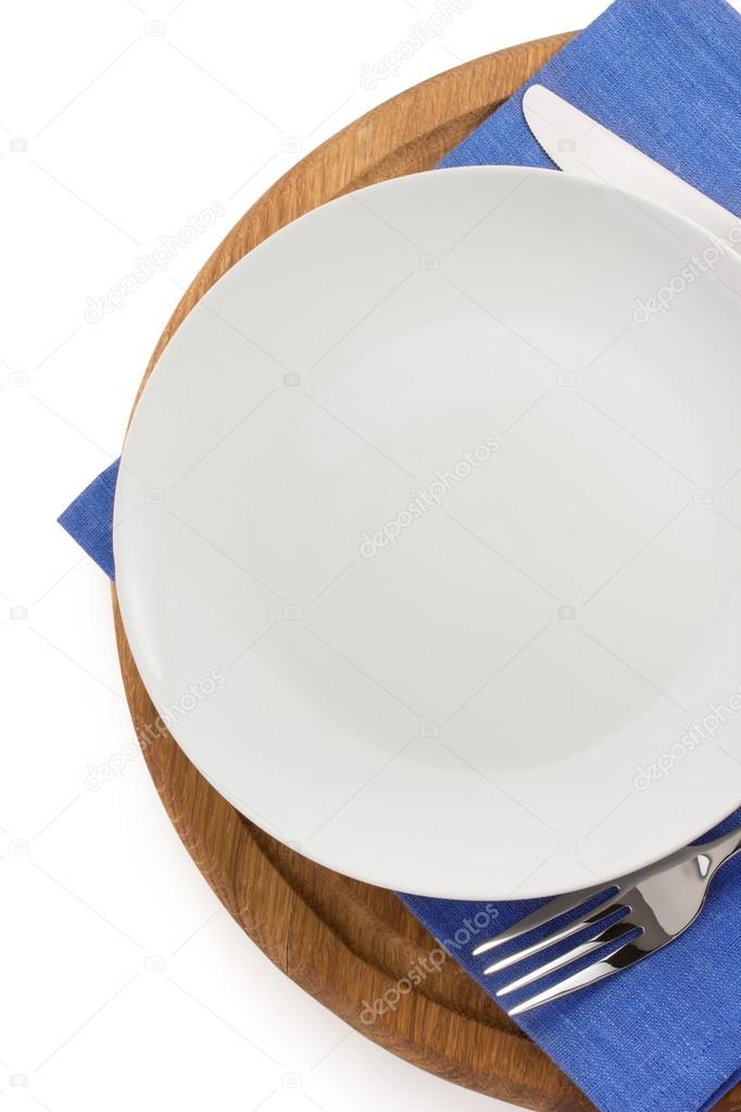 plate, knife and fork  at cutting board 