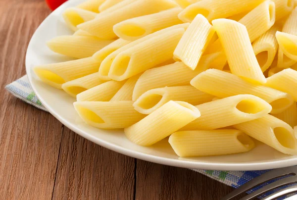 Pasta Penne in plate — Stock Photo, Image