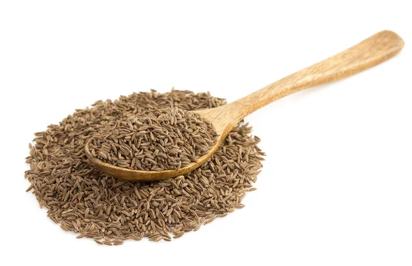 Cumin seeds in spoon on white — Stock Photo, Image